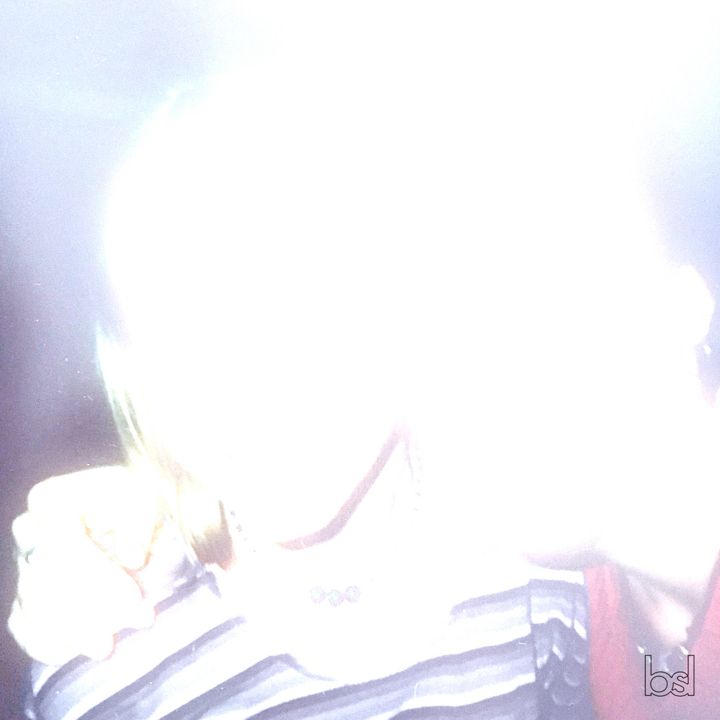 Blissed cover: an overexposed direct-flash snapshot, almost white