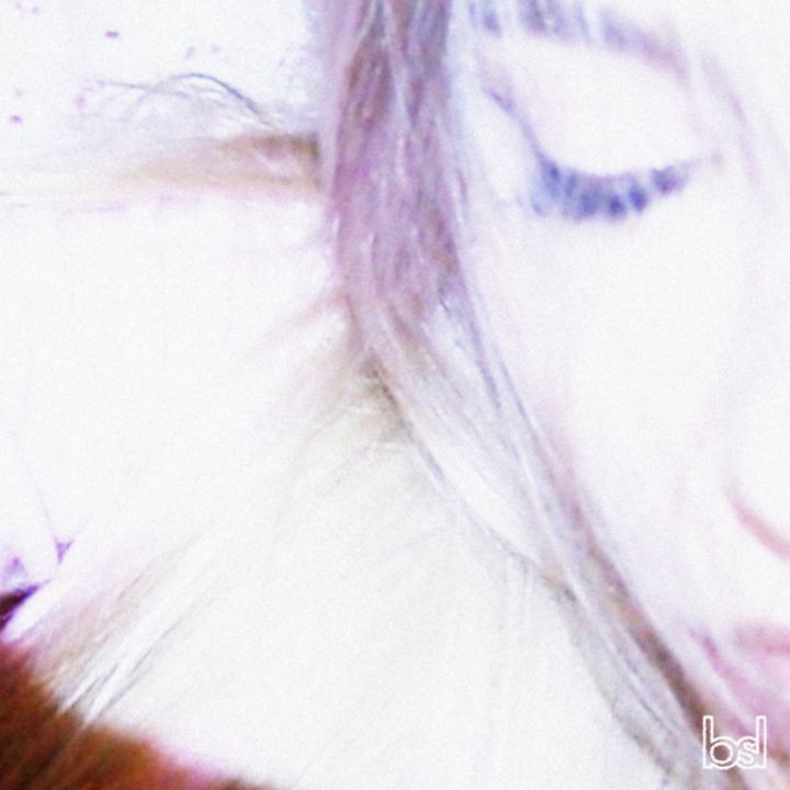 Euphoriphilia cover: a blown-out pastel close-up of a face with eyes closed behind strands of hair