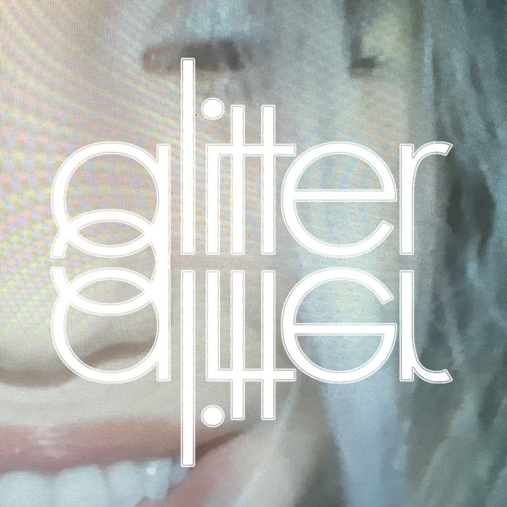 Glitter cover: a soft close-up of a smiling mouth with the word glitter in thin outlined letters, mirrored below